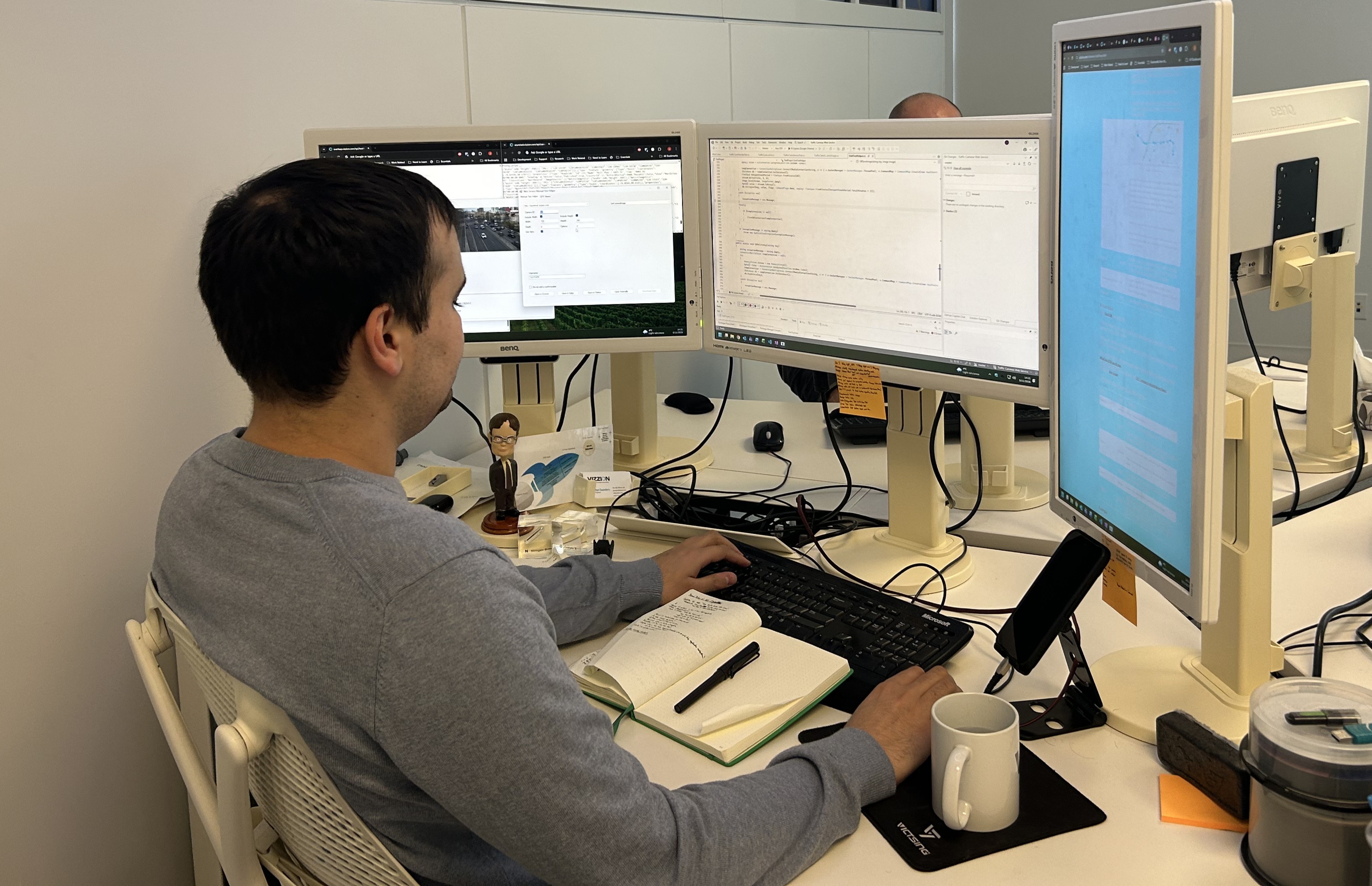 Jonathan working at the Vizzion office.